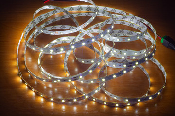LED strip on a wooden table, close-up