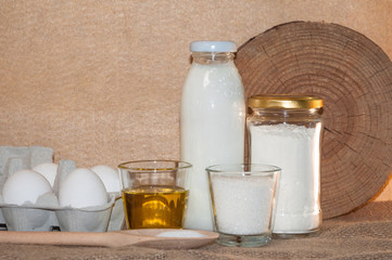 ingredients for dough and baking prepearing pancakes ,flitters,dumplings, vareniks from eggs,flour,milk,salt,sugar and eggs