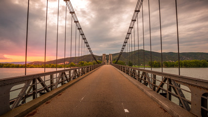 View of the Pont du Robinet bridge with a cloudy sky highlighting its metallic structure, Donzère, France
