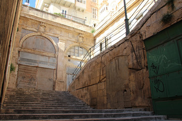 stairs and stone buildings in valletta (malta)