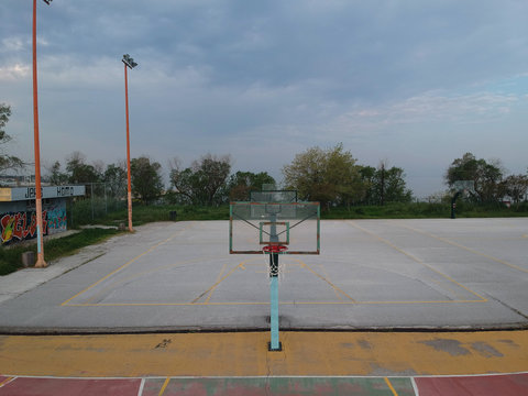 Aerial drone shot over basketball courts in a sports complex in Poseidonio, Thessaloniki Greece