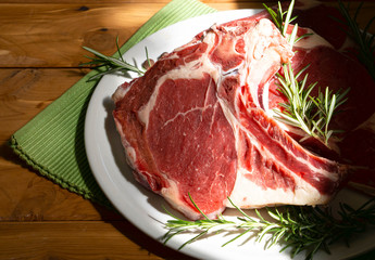 dish with steak on the wooden table