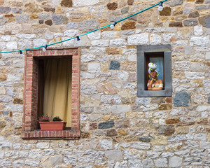 Castellina in Chianti, Siena, Italy - NOVEMBER 2, 2019: view of decorated window in the historical center of Castellina in Chianti