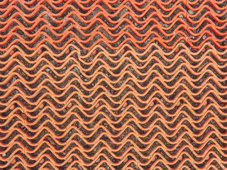 The texture of the plastic grille is red. Wave pattern