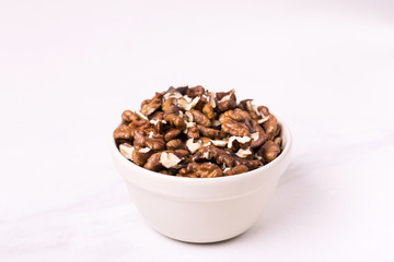 Walnut in bowl. unshelled nuts. vegetarian protein