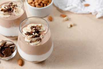 Chia seeds pudding with chocolate and banana smoothie in a glass