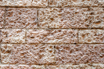 Assisi, the city of peace, Italy. UNESCO World Heritage Site, the birthplace of Saint Francis. Medieval wall detail in typical pink stone.