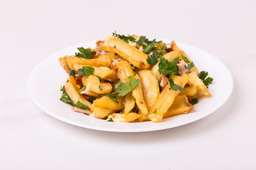 Canadian poutine french fries with brown gravy sauce, chicken and cheese curds.