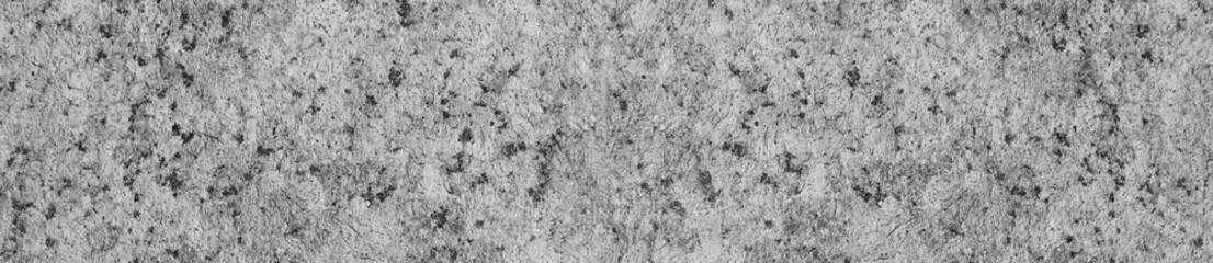 Granite rock texture background close up view. Grey granite mineral stone, simple black and white surface. Natural granite material background, abstract empty seamless rock texture backdrop