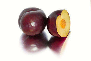 plums on a big background, isolate. bright plums black or red without background.