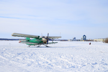 Fototapeta na wymiar Soviet and Russian AN-2 aircraft in the city of Nadym in winter in Northern Siberia