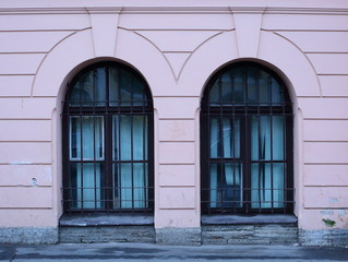 Arched barred Windows of the basement floor