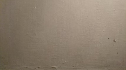 Weathered whitewashed wall texture.