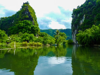 Fototapeta na wymiar Quiet Ride On Peaceful Tam Coc River, Ninh Binh, Vietnam