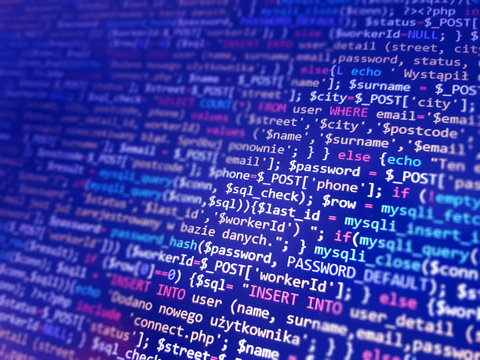 Programming code on monitor screen. Developer work. Abstract background for search job. HTML, php web programming source code.