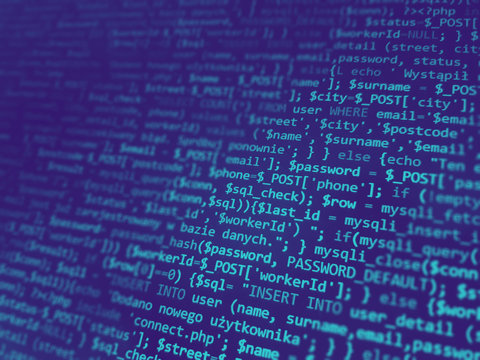 Programming code on monitor screen. Developer work. Abstract background for search job. HTML, php web programming source code.
