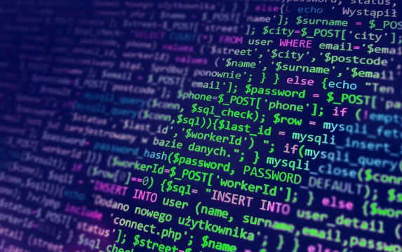 Programming code on monitor screen. Developer work. Abstract background for search job. HTML, php web programming source code.