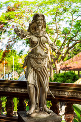 Water Palace of Tirta Gangga in East Bali, Indonesia. Stone figures of balinese gods