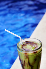 Avocado juice with pool as background.Beverage close up photography.
