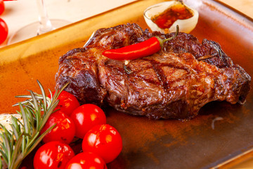meat dish on a plate with vegetables and spices