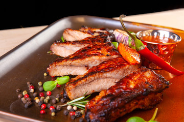 meat dish on a plate with vegetables and spices