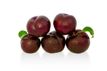 plums on a big background, isolate. bright plums black or red without background.