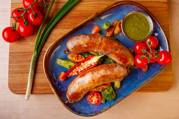meat dish on a plate with vegetables and spices