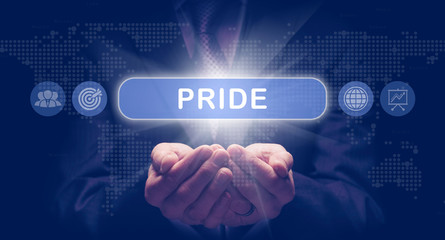 Businessmans cupped hands holding an Pride business concept on a computerised display.