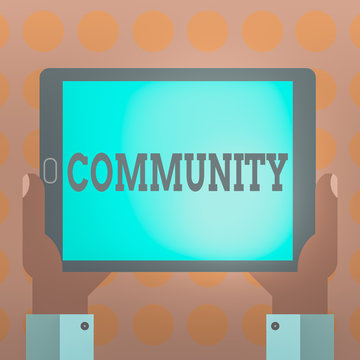 Word writing text Community. Business photo showcasing group of showing with a common characteristics living together Hu analysis Hand Holding Blank Screen Tablet Smartphone Display Unit photo