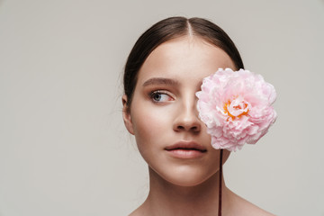 Image of seductive nice shirtless woman posing with pink peony