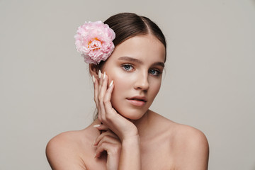 Image of seductive nice shirtless woman posing with pink peony
