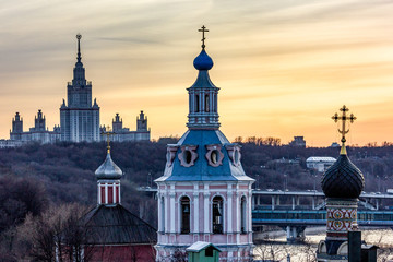 Fototapeta na wymiar Russia. Walk around Moscow at sunset. View of Moscow State University and the cathedrals of Moscow.