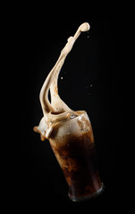 Dark beer levitation with splash