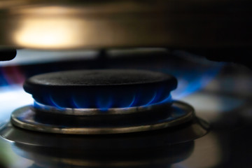 fire stove lit with natural gas fire in a kitchen.