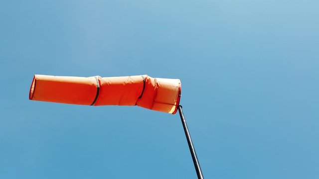 Wind sock wave in wind on sky background