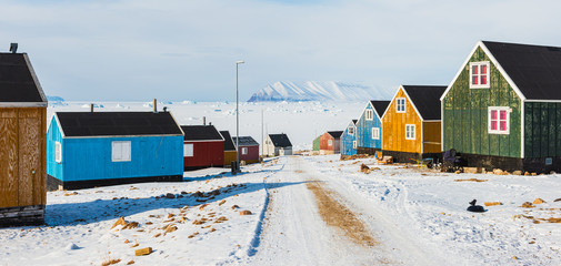 Row of colorful wooden houses, Greenland. © Mikael