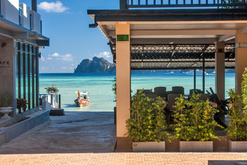 View from the hotel to the sea and boat in the lagoon