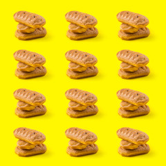Bakery sweet pastry stack pattern on yellow background. Sweet food concept. Square shot