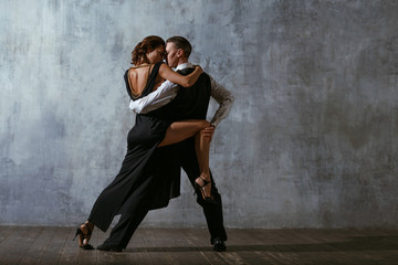 Fototapeta na wymiar Tango pair dancers. Dance in ballroom.