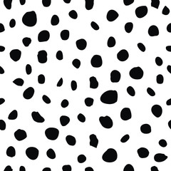 Monochromatic black and white hand drawn polka dot circle motif. Irregular layout, random composition, cool op art design style. Elegant stylish timeless vector. Classic seamless pattern with a twist.