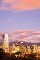Skyline of modern office buildings at Las Condes and Providencia districts with snowed Andes...
