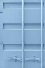 Shipping container door in baby blue tint. Cute pastel colors with metal parts. Background, Wallpaper. Nobody, vertical shot. Straight lines, minimal, minimalistic