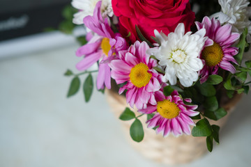 bouquet of gerbera flowers at home in a basket