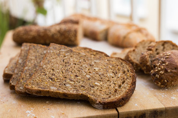 fresh loaf of bread on wooden board