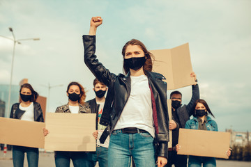 A group of people with mask and posters to protest The protest of the population against...