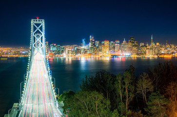 Fototapeta na wymiar Oakland Bay Bridge with San Francisco Skyline at night