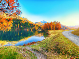 Spectacular autumn view of Champfer lake.