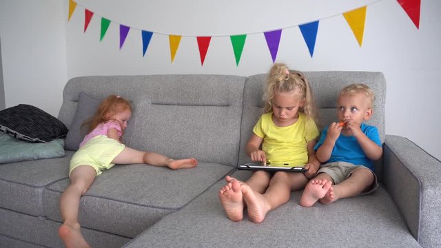 Brother and sister dont share tablet computer with redhead girl friend
