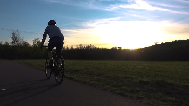 Bike commuter in sunset