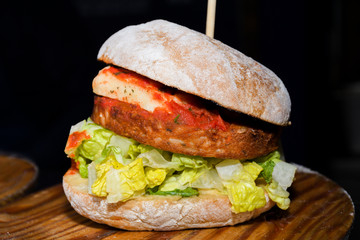 Fresh melting burger ready to eat during fast food festival.